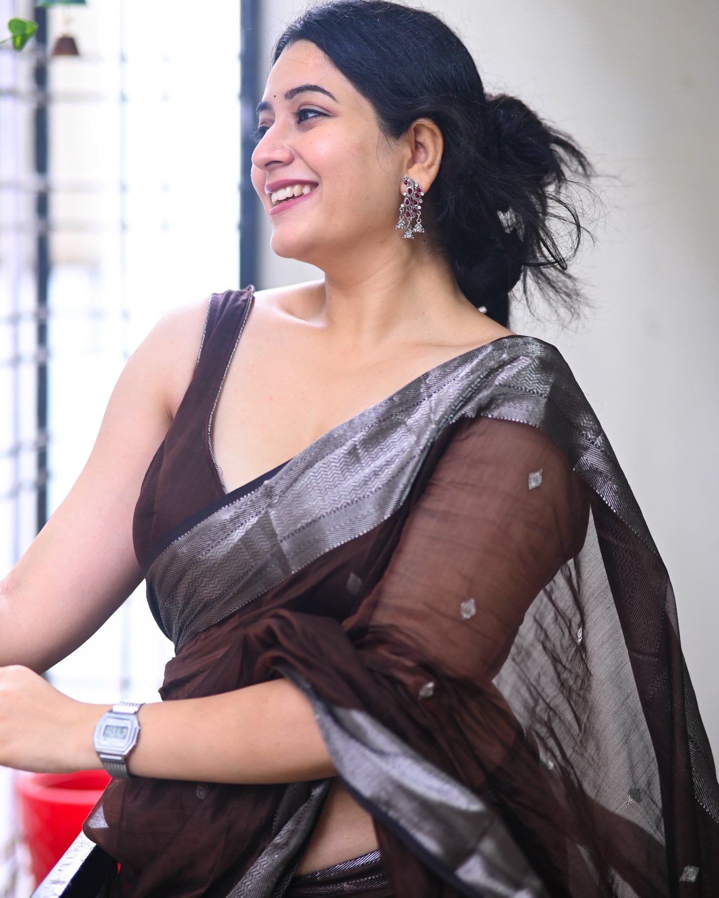 Presenting the Maheshwari Handwoven Silver Buti Saree in Brown Colour