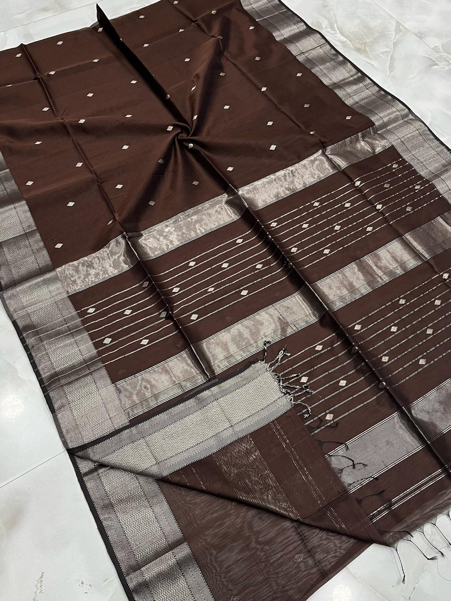 Presenting the Maheshwari Handwoven Silver Buti Saree in Brown Colour